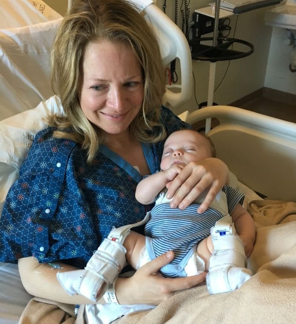 Jess holding her son, Stanley, in the hospital after her stroke in 2019. 